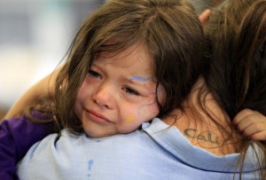 Cali Farmer cries as she hugs her mother Netta Farmer at California Institute for Women state prison in Chino